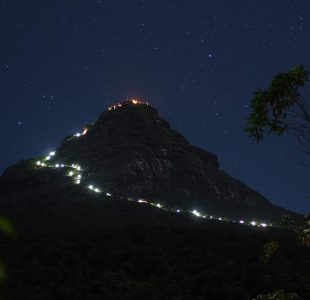 Night view of Adam’s Peak with glowing lights trail. Discover Islandwyde’s Adventure sri lanka holiday packages tours.